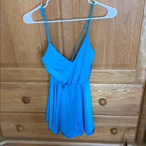 blue open back romper (price tags still on)